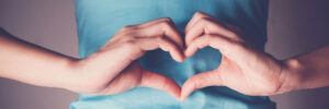 Two hands shaped to create an iconic heart